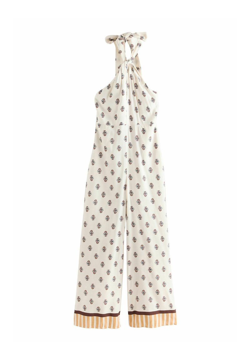 Jumpsuit bez rukava, s halter vratom od bijelog tkanja s cvjetnim uzorkom, širokih nogavica i prugastim detaljima na rubu.