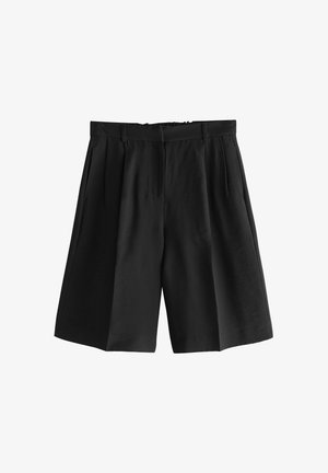 Musta, korkeavyötäröinen, plisseeolkaiminen polvipituinen shortsit, joissa vyölenkit ja sivutaskut, valkoista taustaa vasten esillä.