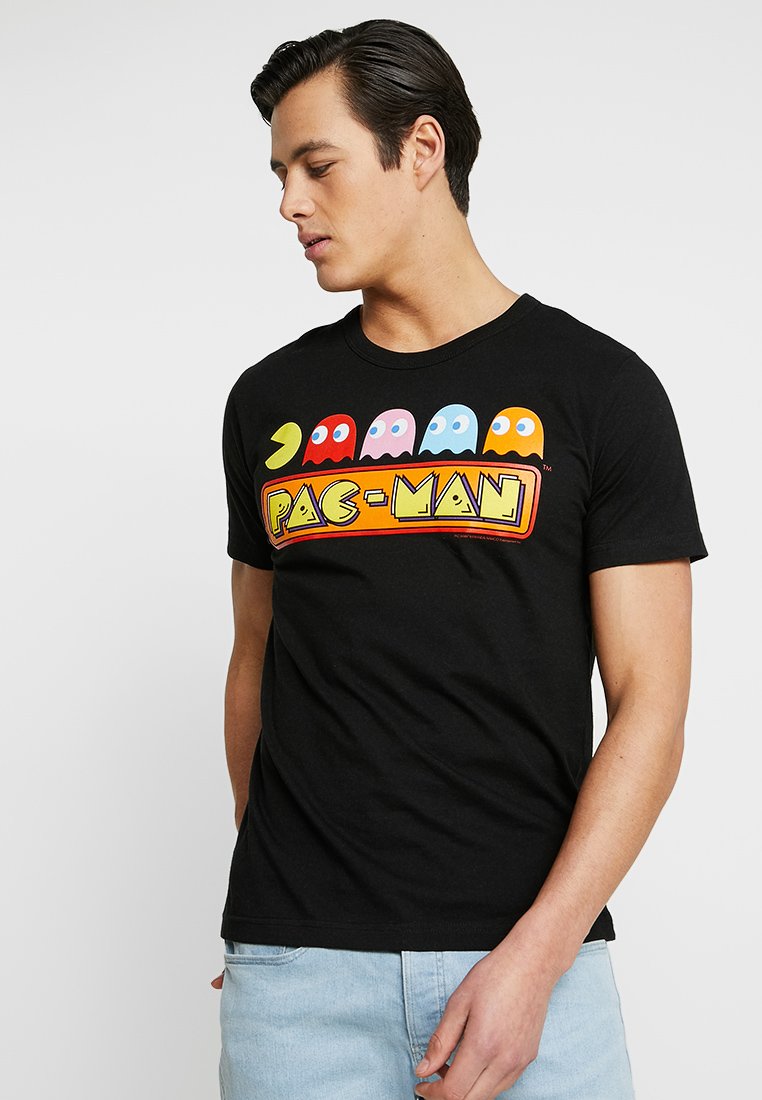 Black cotton t-shirt featuring a colorful Pac-Man graphic with characters and text across the front. Short sleeves and crew neck design.