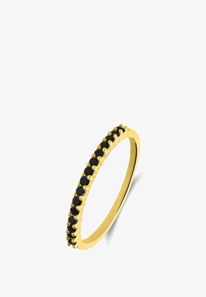 Bague en or avec une bande délicate et une rangée de pierres noires alternées, présentant un design épuré avec une texture polie.