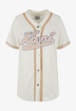 Grietos spalvos beisbolo marškiniai su smėlio spalvos juostelėmis, mygtukų uždarymas ir baltu siuvinėjimu "Kani". Pagaminti iš kvėpuojančios medžiagos, kad būtų patogu.