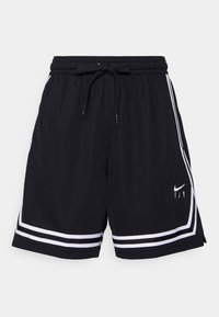 Pantalones cortos deportivos negros fabricados con tejido texturizado, con rayas laterales blancas, cintura con cordón y logo de Nike bordado en la parte delantera.