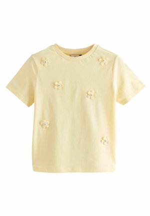 T-shirt en coton jaune à col rond et manches courtes, comportant six appliqués de fleurs en tissu avec des centres en strass.