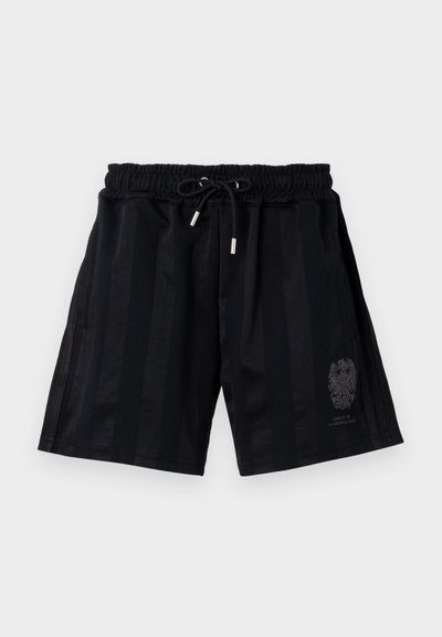 Čierne športové nohavice s elastickým pásom a šnúrkou, s horizontálnymi pruhmi a jemným emblémom na ľavom stehne.