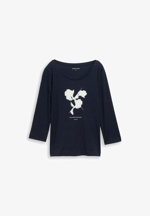 Tumedat sinise pikkade varrukatega t-särk pehmest kangast, millel on keskel valge graafiline trükk pealkirjaga "ALPINE ESCAPE".