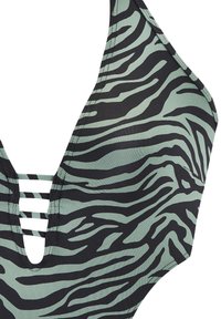 Bikini vrh s živalskim vzorcem, ki vsebuje zeleni in črni zebrin vzorec, V-ovratnik ter vodoravne trakove za dodatni vizualni interes.