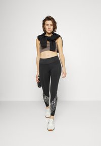 Reebok MODERN SAFARI - Leggings - night black