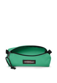 Green fabric pencil case with a zip closure, black accents, and an external logo patch. Interior is smooth and spacious.