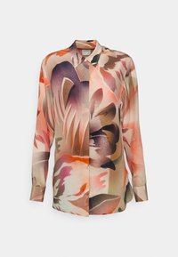 Blouse florale multicolore avec un design à boutons, manches longues, et une texture de tissu lisse offrant une silhouette douce et fluide.