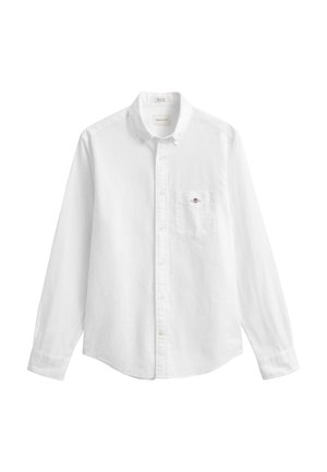 Camicia bianca a maniche lunghe con colletto, taschino sul petto con piccolo logo ricamato e polsini con bottoni.