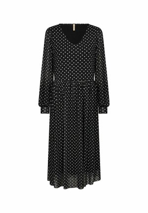 Juoda ilgai rankovė su V formos iškirpte, papuošta baltais taškeliais, turinti susiraukšlėjusią liemenį ir laisvą siluetą. Minkšta, lengva medžiaga.