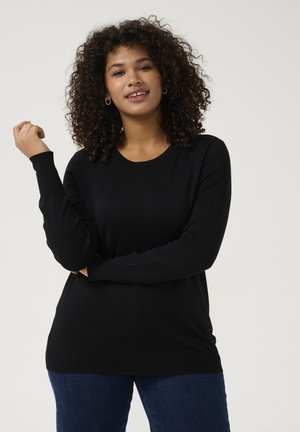 Black long-sleeve sweater with a round neckline. Made from a smooth, soft fabric. Features ribbed cuffs and hem for detail.