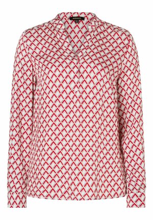 Long-sleeve blouse in white fabric featuring a geometric red pattern. Notable details include a pointed collar and buttoned cuffs.