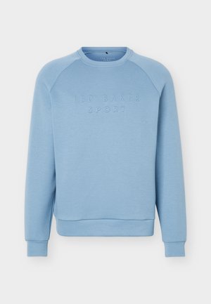 Sweat-shirt bleu clair à col rond avec manches longues et poignets côtelés, avec texte en relief "TED BAKER SPORT" sur la poitrine.