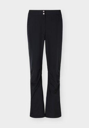 Czarne damskie spodnie z dwoma srebrnymi guzikami w pasie, prostymi nogawkami i lekkimi zagnieceniami w okolicy kolan.