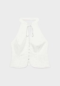 Haut blanc sans manches avec col licou, fermeture à boutons sur le devant et nœud au niveau du col, légèrement évasé en bas.