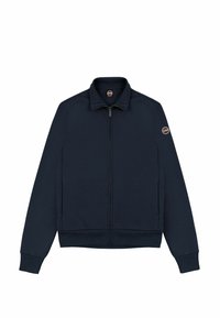 Jūras zilas krūšu jakas ar rāvējslēdzēju, izgatavotas no mīkstas auduma, ar stāvošu apkakli, ribotām aprocēm un logo uzplēsi kreisajā rokā.