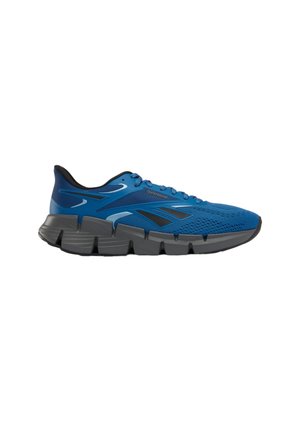 Scarpa da ginnastica atletica blu con tomaia in mesh traspirante, suola spessa segmentata nera e grigia, e logo Reebok nero sul lato.