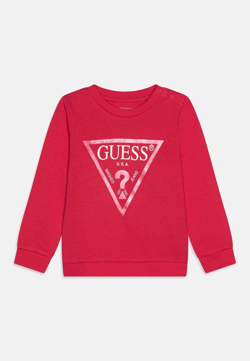 Red sweatshirt made of cotton featuring a large white triangular logo with "GUESS U.S.A." text and a question mark design. Includes snap buttons.