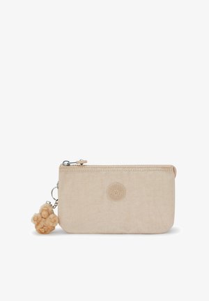 Beige zippered pouch with textured fabric, embossed logo on front, and a beige pom-pom charm attached to the zipper pull.