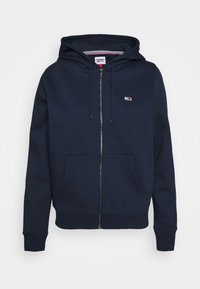Felpa con zip color navy realizzata in misto cotone, con tasca frontale, cappuccio con lacci e un piccolo logo sul petto.