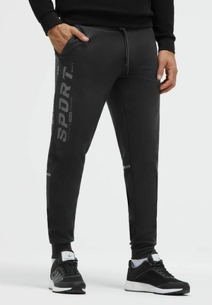 Camp David, CAMP DAVID JOGGPANTS AUS INTERLOCK-PIKEE MIT ARTWORKS - Jogginghose - black