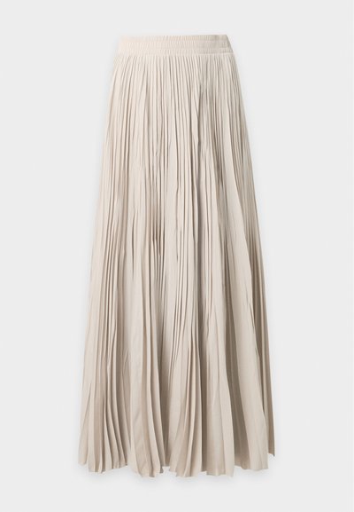 Longue jupe beige plissée avec taille élastique, tissu fluide et longueur complète.