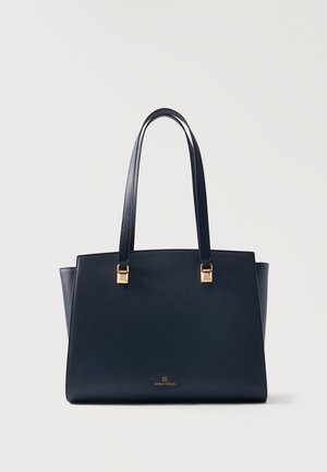 Czarna torebka typu tote z dwoma uchwytami i złotymi elementami, z małym logo "Anna Field" na dole pośrodku.