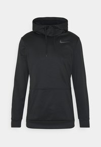 Haut à capuche noir Nike avec poches zippées à l'avant, cordon de serrage à la capuche et logo Nike sur la poitrine, sur fond blanc uni.