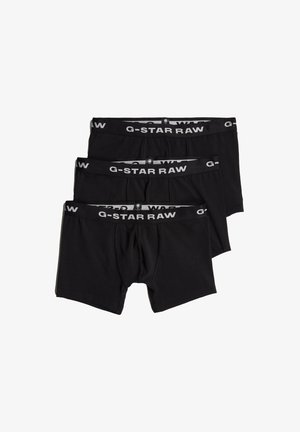 Schwarze Baumwollboxershorts im Dreierpack. Jede Shorts verfügt über einen weißen Logobund mit "G-STAR RAW" und einer glatten Textur auf der gesamten Fläche.