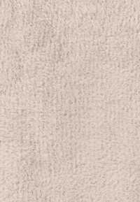 Faux fur fabric in a light beige color with a soft, textured surface. Features subtle variations in tone and a dense, fluffy appearance.