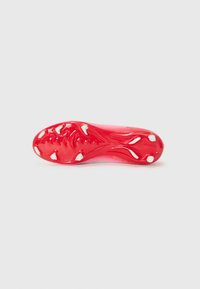 Red soccer cleat sole with a textured surface, featuring six white studs for traction and a smooth finish along the sides.