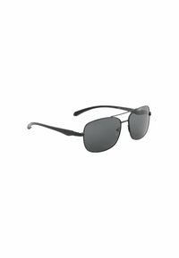 Juodos aviator stiliaus saulės akiniu su tamsiais stiklų tonu, metaliniu rėmu ir lenktais nosies pagalvėlėmis. Ploni, tiesūs šonai su subtilia vyržio detale.