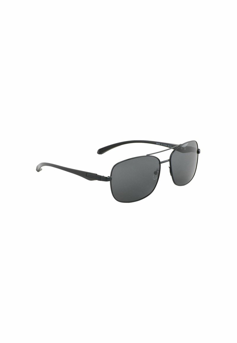 Juodos aviator stiliaus saulės akiniu su tamsiais stiklų tonu, metaliniu rėmu ir lenktais nosies pagalvėlėmis. Ploni, tiesūs šonai su subtilia vyržio detale.