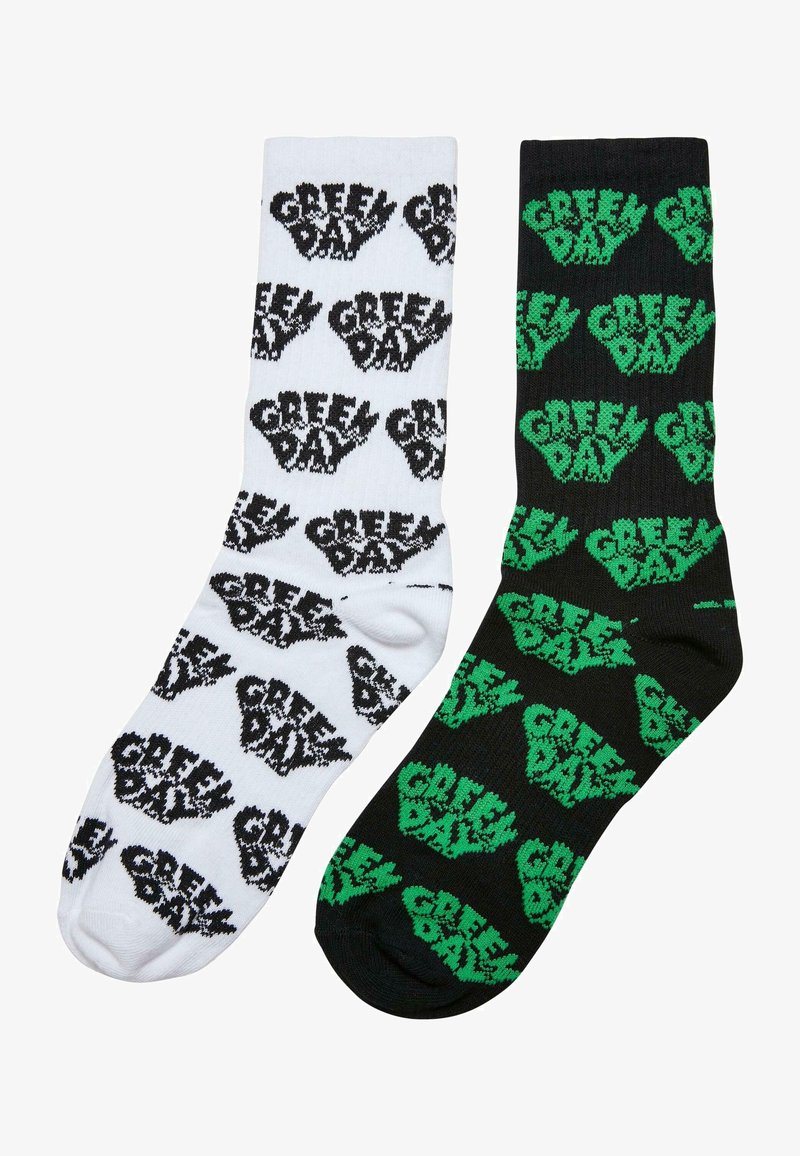 Chaussettes de crew noir et blanc présentant des logos et des mains graphiques "Green Day" répétés, fabriquées en coton, avec une texture douce et tricotée.