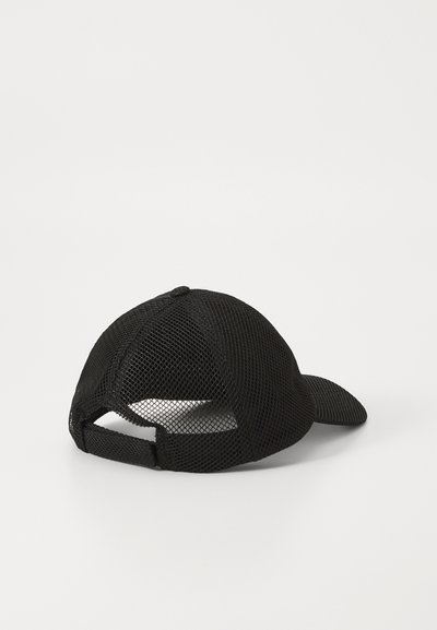 Black mesh baseball cap lying on a flat surface, showing the adjustable strap at the back and curved visor.