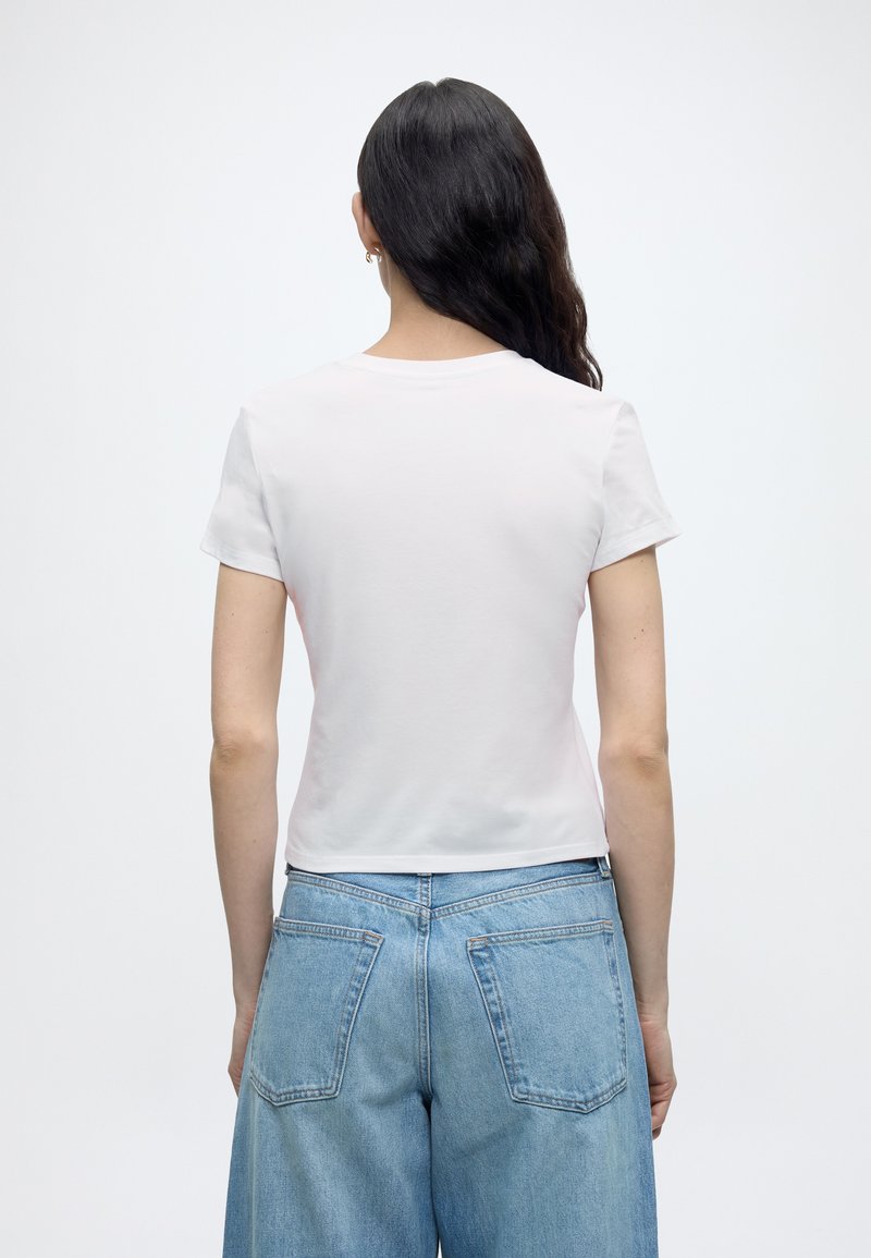 Calvin Klein COMMUTER BABY TEE - Triko s potiskem - classic white