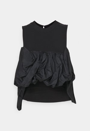 Μαύρη αμάνικη τοπ με εφαρμοστό επάνω μέρος και φουσκωτό, συγκεντρωμένο κάτω μέρος. Λείο υλικό με αντιθετικά στρώματα υφάσματος.