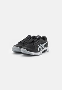 Black athletic shoes with a mesh upper, textured toe cap, reflective silver stripes on the sides, and white rubber soles.