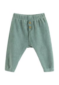 Grønne corduroypants med elastisk talje, der har to træknapdetaljer og en struktureret, ribbet stofdesign.