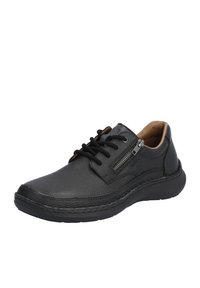 Black leather shoes with a textured finish, featuring lace-up design, side zip detail, and a cushioned sole.
