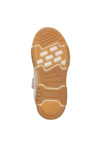 De zool van de schoen heeft een patroonontwerp van rubbermateriaal. De kleur is lichtbruin met witte accenten en verhoogde grippunten voor tractie.