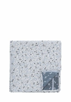 Woven cotton blanket features a floral pattern in light blue and gray, with a textured reverse side in a solid dark blue hue.