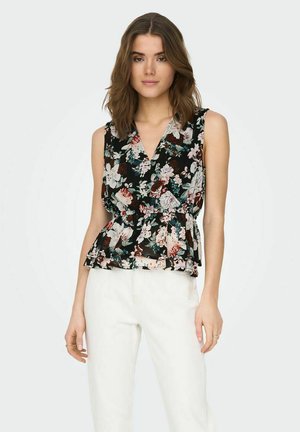 Top peplum floreale in nero con stampe multicolori di rose e foglie, dotato di scollatura a V profonda e senza maniche. Abbinato a pantaloni bianchi.
