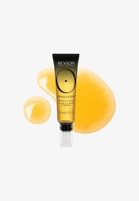 Tubo de Revlon Professional Orofluido Argan Oil Elixir con gotas de líquido dorado sobre un fondo blanco.