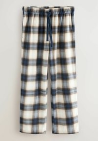Rutig pyjamasbyxor i blått, svart och vitt bomull. Har elastisk midja med snörning och sidofickor. Rak bendesign.