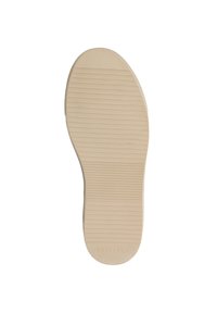 Beige rubber zool met horizontale griplijnen en "TRAVELIN' 37" gedrukt nabij de hak op een witte achtergrond.