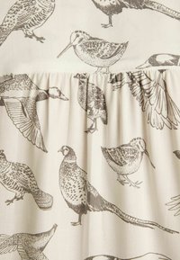 Cotton fabric with a light beige background featuring intricate brown bird illustrations, including various species in flight and standing.