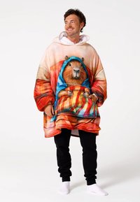 Fleece oversized hoodie featuring a colorful illustration of a capybara in a blue hood, with a vibrant background and loose-fitting design.
