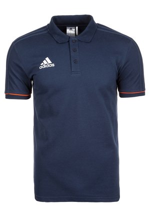 Granatowa koszulka polo Adidas z trzema guzikami, białe logo na piersi i pomarańczowymi lamówkami na krótkich rękawach.
